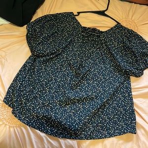 Size M blue with tiny flowers little opening in the back runs big